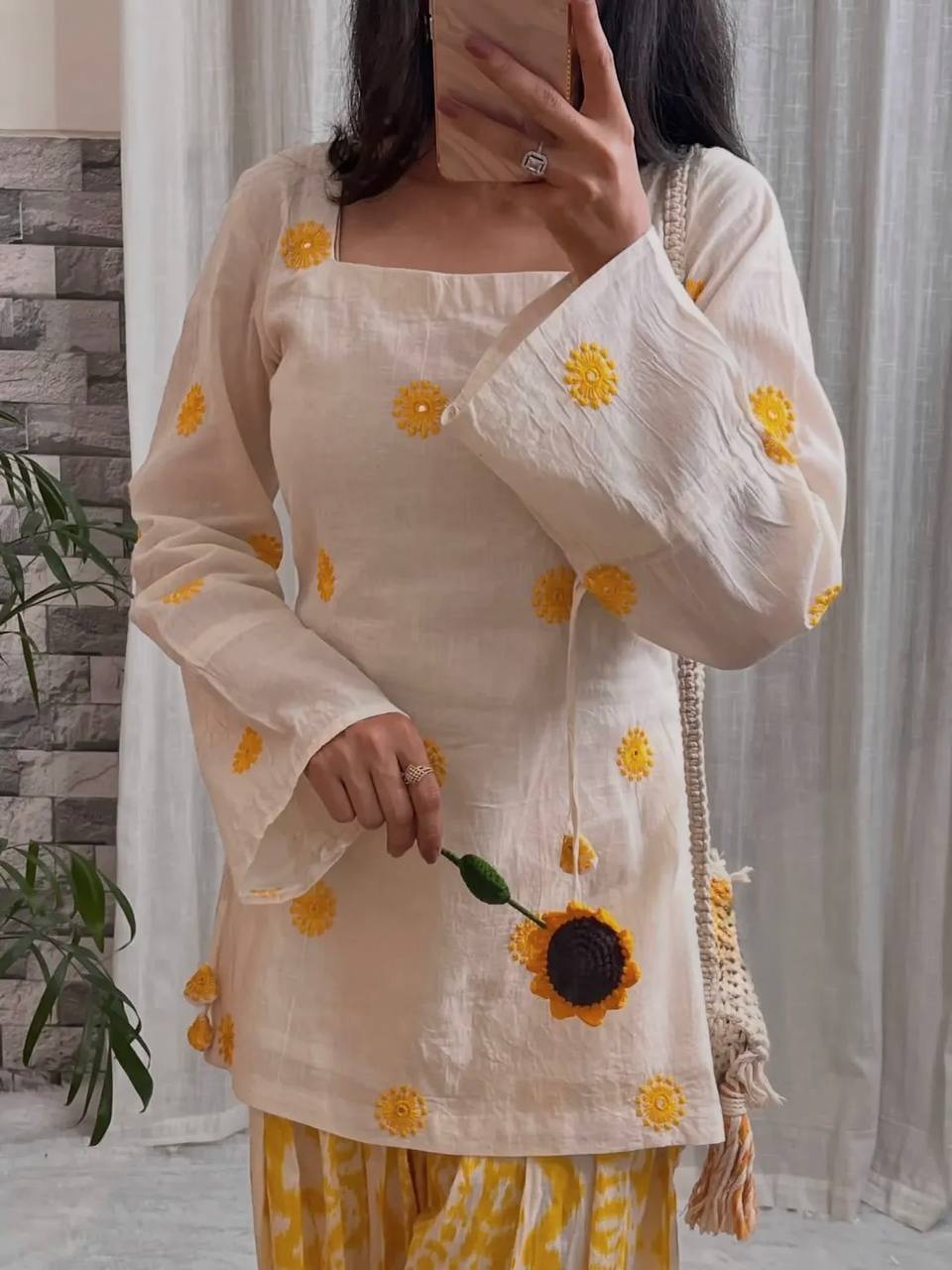 Radiant Ivory White Short Kurti Adorned with Sunshine Yellow Embroidery Paired with a Flowy Patterned Farshi Salwar